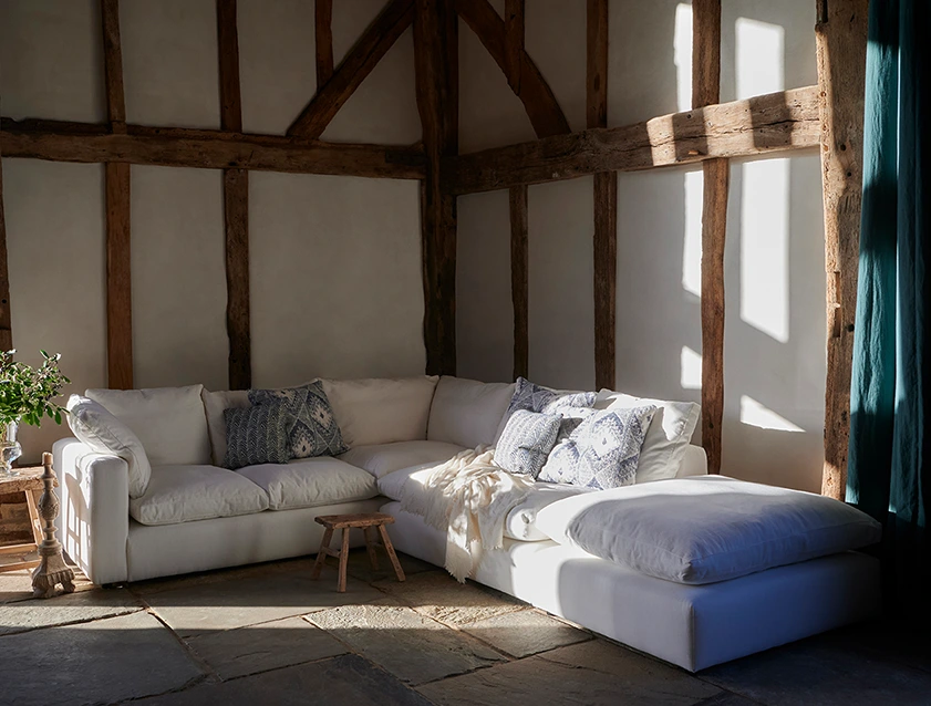 Big Softie Straight Arm Large Corner Group LHF and Footstool in Romo Linara Coconut with Scatters in William Yoeward Nizhoni Indigo & Malla Indigo_tablet